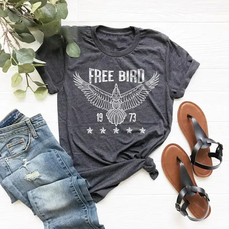 Free Bird 1973 Eagle Graphic Tee, Retro Boho Thunderbird Shirt with Spread Wings and Stars, Vintage Inspired Unisex Classic T-Shirt